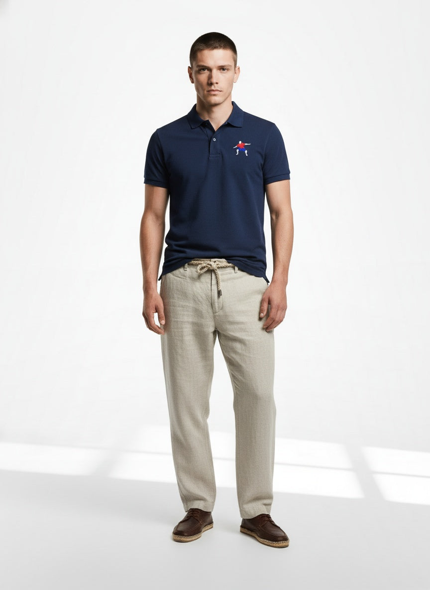 Full body view of the model wearing Adidas Performance Polo- Navy white arms logo